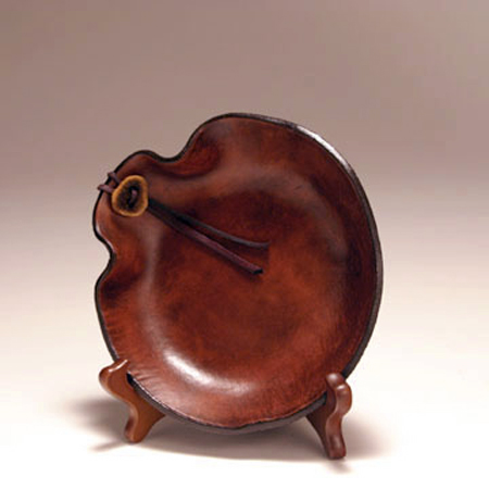 Hand formed leather bowl, small round.