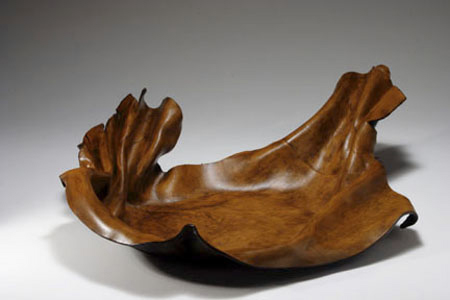 Hand-formed leather bowl, sculpted.